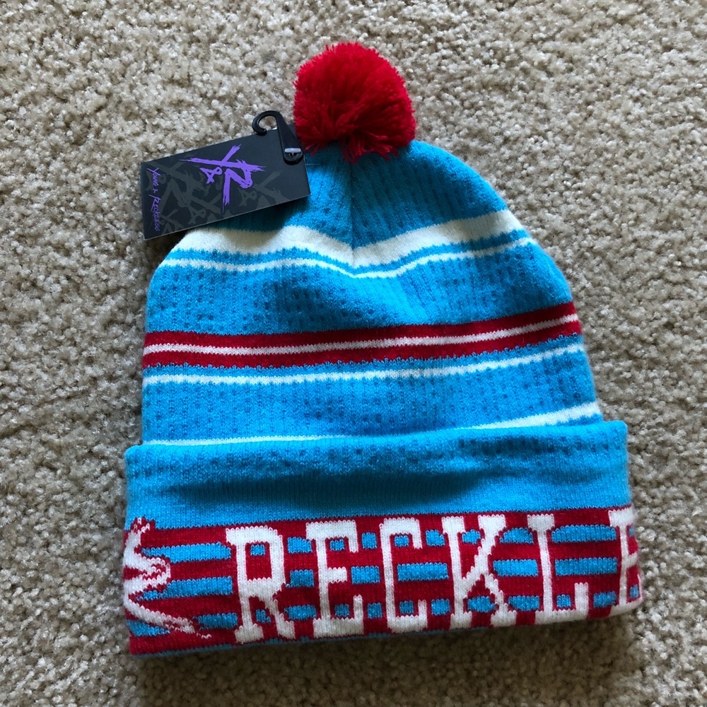 Young and reckless beanie striped with red pom pom